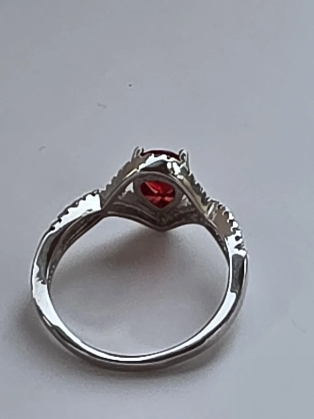 Sterling-Inspired Silver Ring with Pear-Shaped Red Gem and Pavé Halo